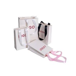 China Square Bottom Kraft Paper Gift Bags With Handles for Shopping and Cardboard Material factory