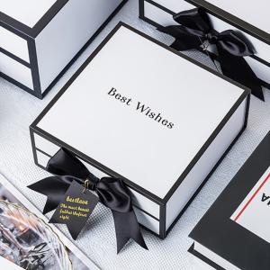 China Rigid White Magnetic Cardboard Gift Boxes With Black Rim And Ribbon Bow factory