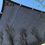 Black bulk anti-ultraviolet fabric mesh belt with grommets on the edge of plant