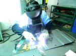 Custom metal stamping parts on truck, including weld assembly and power painting