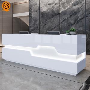 China LED Light White Salon Reception Desk With Solid Surface Material factory