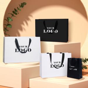 China Cardboard Stamping Printed White Gift Paper Shopping Bags With Logos For Promotion factory