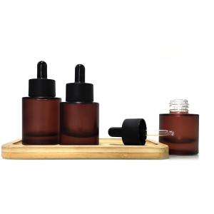 China Flat Shoulder Glass Serum Bottle Cosmetic Packaging Bottles Leakproof factory