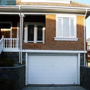 China PU Foaming Galvanized Steel Overhead Garage Door IP55 With Windows factory