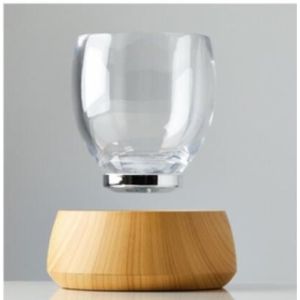 China 360 rotating magnetic floating bottom coffee cup water cup factory