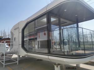 China Prefabricated Apple Cabin House Capsule Container Prefab House For Coastal Hotel factory