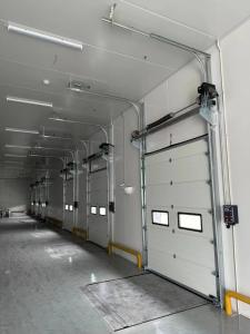 China Overhead sectional door is one of most widely used among in industrial doors at present factory