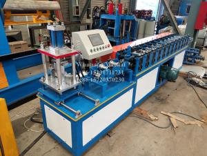 China Steel Aluminium Shutter Door Roll Forming Machine With Hydraulic Cutting Device factory