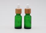 Green Oil 18mm Cosmetic Glass Dropper Bottles With Bamboo Dropper Printing