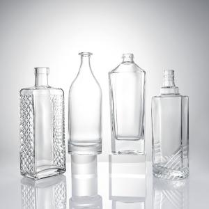 China Clear Glass Liquor Bottle with Embossed Body and Cork Stopper factory