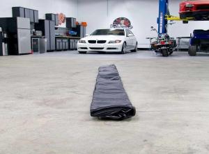 China Soft PVC Inflatable Car Wash Mat Cleaning Garage Floor Containment Mats factory