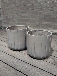 China Exquisite Hand Carved Fiber Clay Planter with Drainage Holes factory