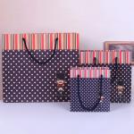 Customised cheap paper bag for children's clothing packaging shopping bags
