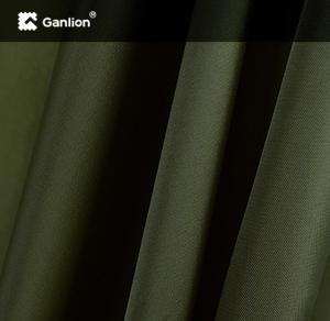 China Olive Green Polyester PBT Fabric Twill 2/1 Stretchable Pants Fabric factory