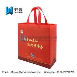 China Customized Red Eco Non Woven Bags With Tote Handles Foldable Bag 100gsm factory