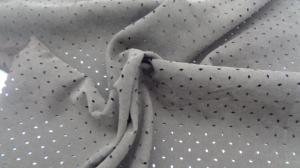 China Sports Dot Woven Dyed Twill 140G Punched Clothing Fabric 150Cm 100% Polyester factory