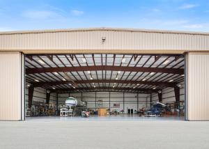 China Paint / Galvanized Surface Prefabricated Hangar Steel Construction Hangar For Aircraft factory