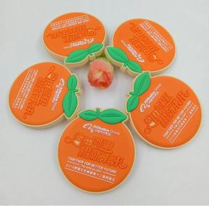 China Custom Orange Shape Embossed Rubber Soft PVC Badges With Safety Pins For Alibaba 12th Birthday factory