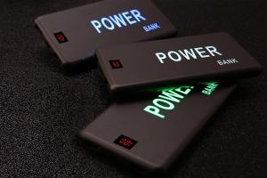 China Custom Laser LED Logo Flashing Light Portable Mobile Power Bank 5000mAh for Promotional gift factory