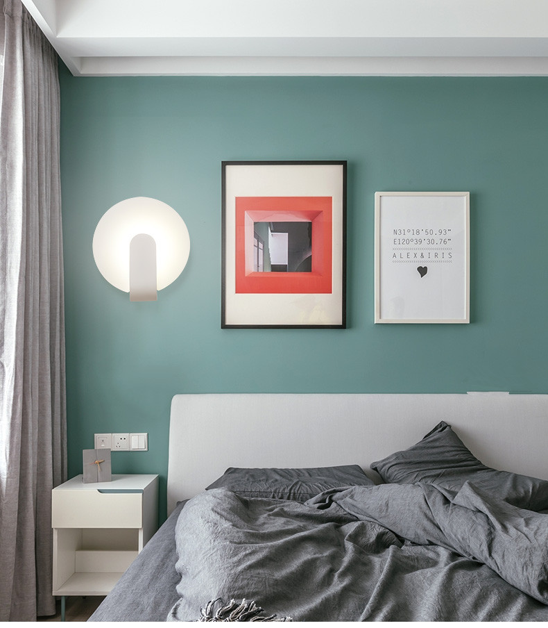 Modern simple and creative bedroom bedroom iron art wall lamp.