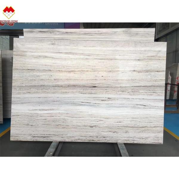 White Wood Look Marble Tiles Stair Follow Veins for a Versatile and Timeless Design