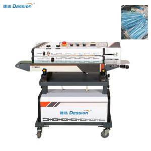 China Continuous Medical Mask Vacuum Sealer Vacuum Mask Packaging Machine factory