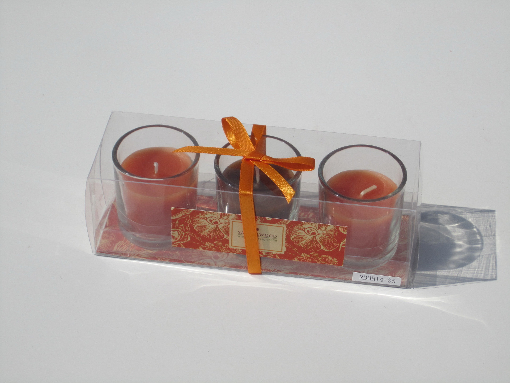 3pk Orange & Brown scented & assorted glass candle with printed label,ribbon decor and packed into clear box