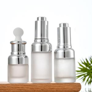 China Round Glass Bottle Alu Dropper Essential Oil Bottle with Box Customize Luxury Oil Push Button Flat Shoulder 20ml 30ml 50ml factory
