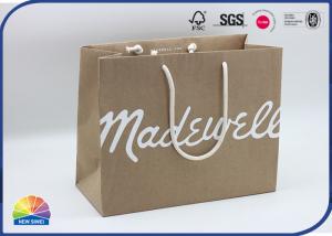 China Matte White Logo Kraft Paper Bag Silk Screen Print Large Bag for Apparel with Rope on sale