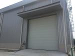 Prefab Steel Structural Workshop Warehouse Wind Resist With Electric Rolling Up