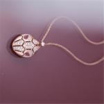 Roman Serpenti necklace in 18 kt rose gold set with rubellite eyes and with pavé