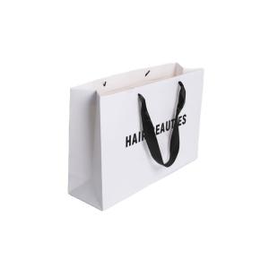 China Ribbon Handle Ivory Board Paper Bags With Custom Logo For Handmade Clothing Packaging factory