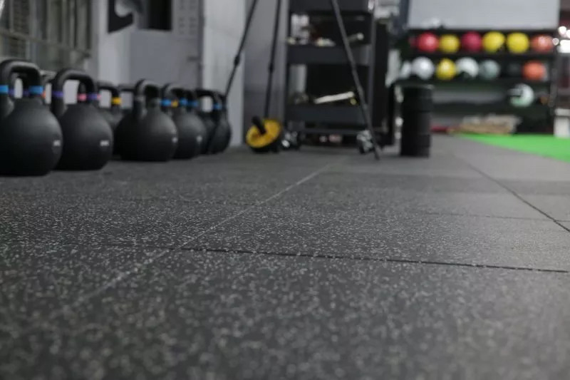 Green gym rubber flooring tiles close-up