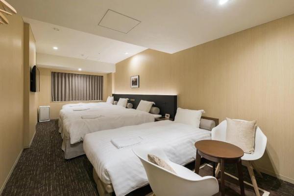 Auckland hotel inn resort Laminate wood headboard bed with in wall cabinet and
