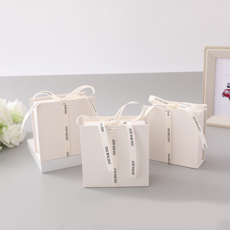 White Ribbon Logo Foldable Gift Box Make Up Clothes Accessories Rigid Paperboard With Glossy Lamination