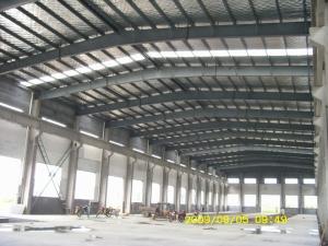 China steel structure frame workshop warehouse and sandwich panel wall roof and roller shutter door factory