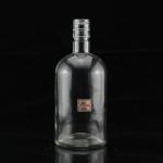 Industrial 700ml Glass Bottle for Beverage Industry in Thumb Shape