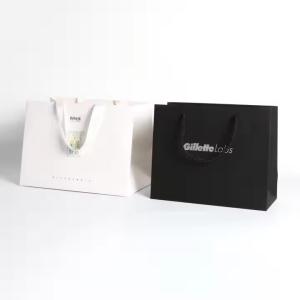 China Customizable Logo Paper Packaging Bags With Silk Ribbon Handle factory