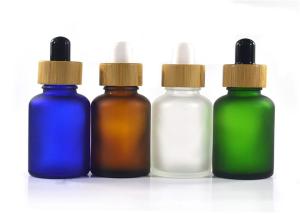 China 50ml Matte Green Blue Glass Dropper Bottles Child Proof With Bamboo Lid factory