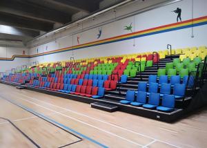 China Floor Mounted Football Stadium Bleachers , Retractable Bleacher Seating With Wall Attached Platform factory