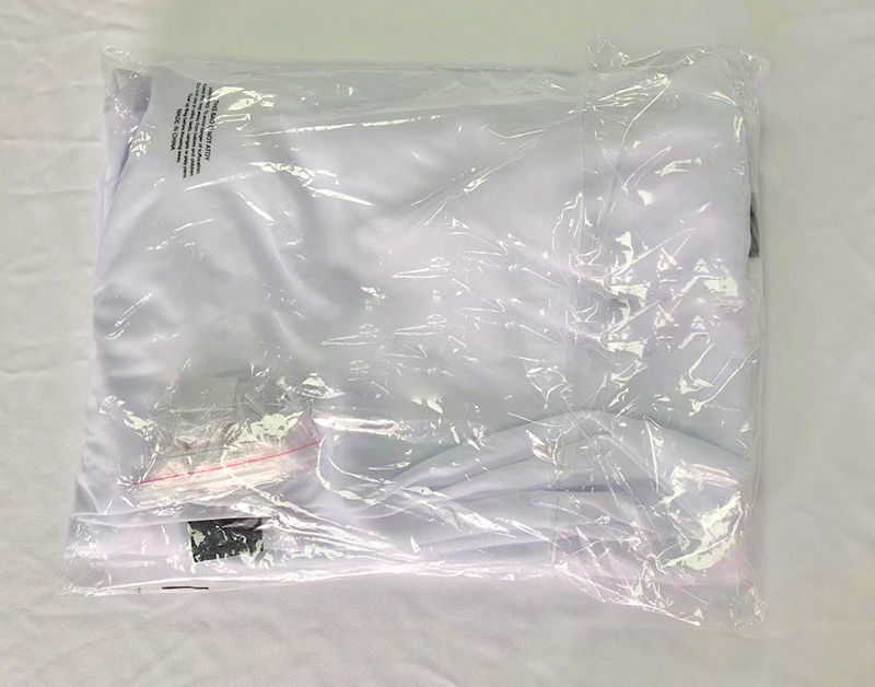 Projector screen retraction mechanism