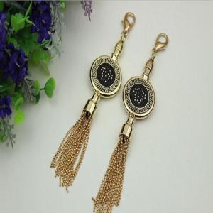 China Novelty DIY high-grade bag hardware accessories light gold drip glue hanging charm with tassel factory
