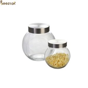 China 50ml Honey Jar And Spoon Flat Bottle With Metal Lid factory