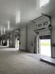 sectional door is opened vertically or bendly suspending under the ceiling by