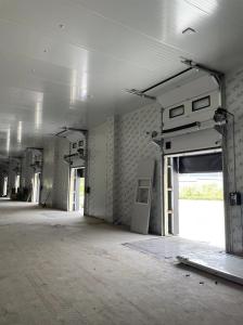 China sectional door is opened vertically or bendly suspending under the ceiling by electric operation factory