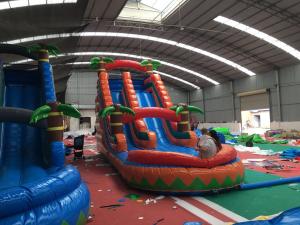 China Outdoor Backyard Blow Up Water Slide With Forest Palm Tree 3 Layer PVC Vinyl Material factory