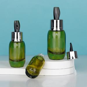 China Skin Care Serum Cream Bottles 15ml 30ml 50ml Clear Green Glass Designs with Stirring Stick Customizable factory