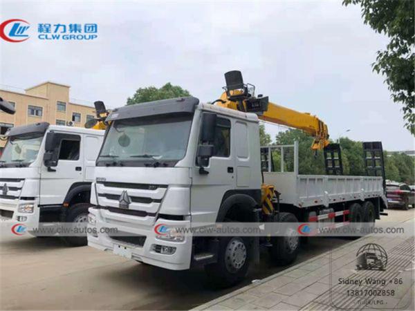 China 8x4 HOWO Flatbed Truck Mounted Telescoping Boom Crane factory