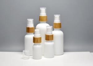 China Glass Skin Essence Oil Packaging Opal White Glass Bottles With Bamboo Pump Spray, Glass Primary Cosmetic Containers factory