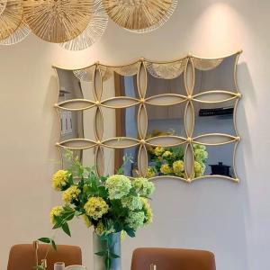 China 5 Star Hotel Light Luxury Style Metal Frame Wall Decorative Artistic Mirror factory